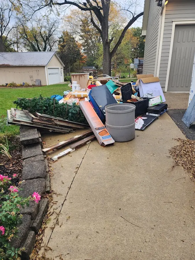 Dumpster being loaded with debris for 10 Yard Dumpster Rental in Punxsutawney